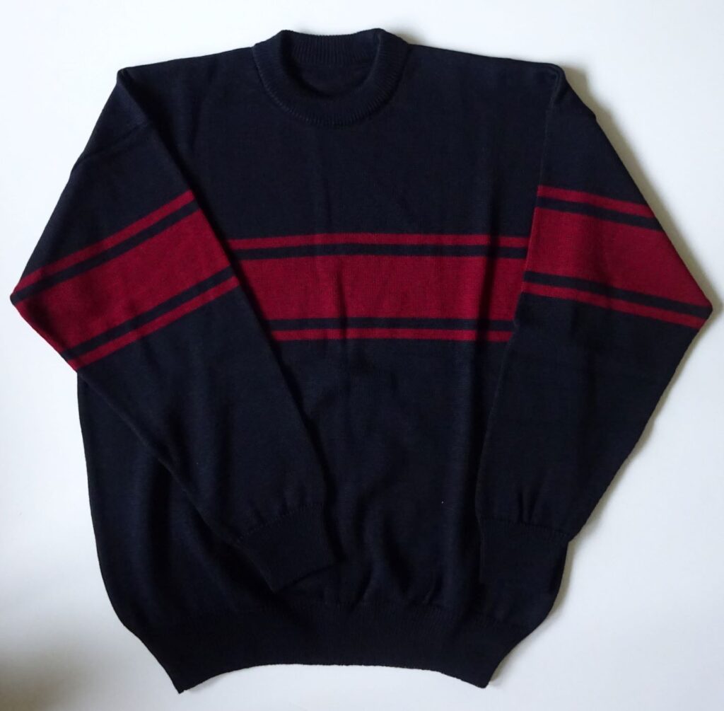 Men's pullover with contrast stripe across chest and arms